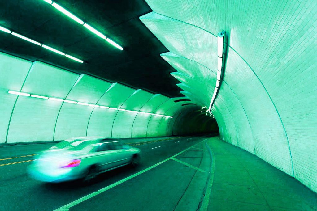 Urban tunnel car moving with motion toned